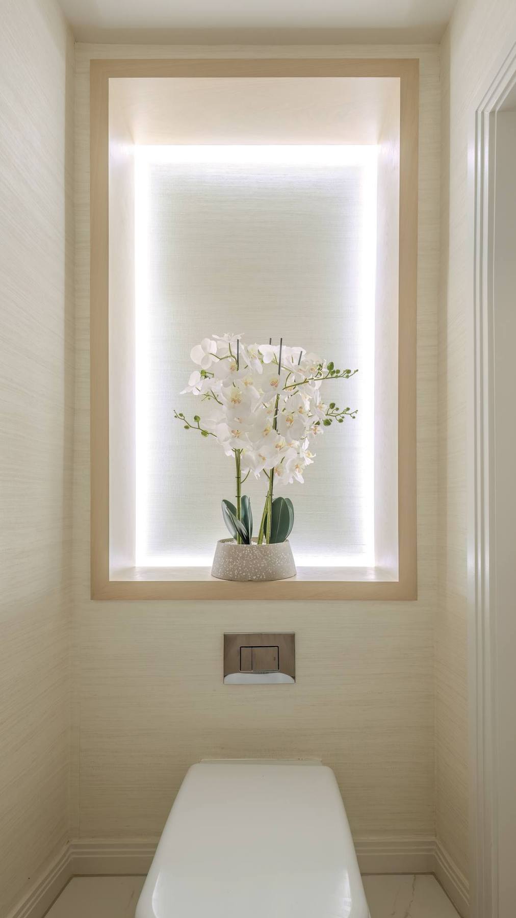Illuminated niche with orchid
